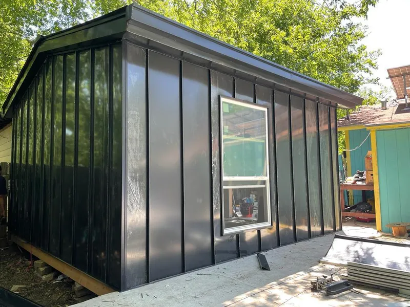 Black standing seam metal wall panels for Roof Inspection in Hornell