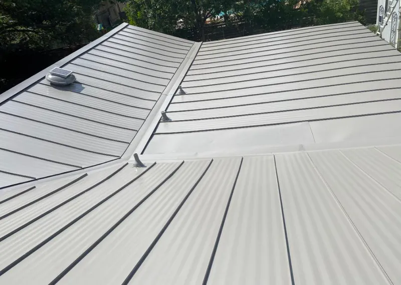 Solar attic fan installed on a metal roof for Roof Ventilation in Hornell